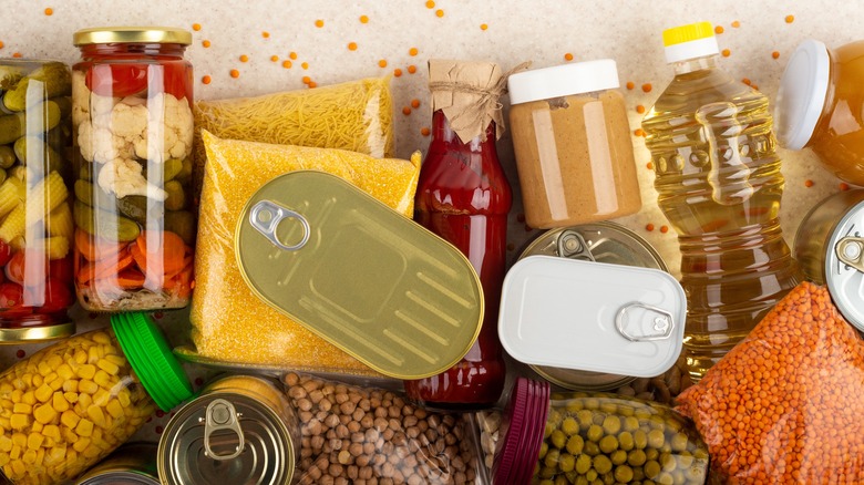 a cluster of nonperishables in cans, jars, and bottles