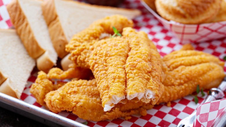 Flaky fried catfish with sliced white bread