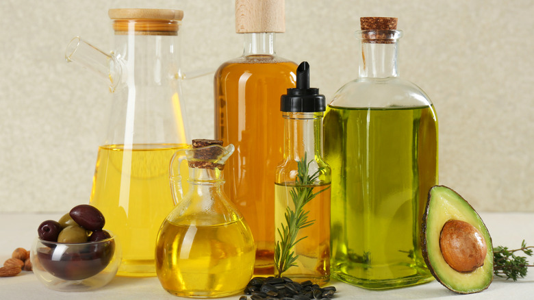 Various types of cooking oils including avocado, olive, and sunflower seed oil