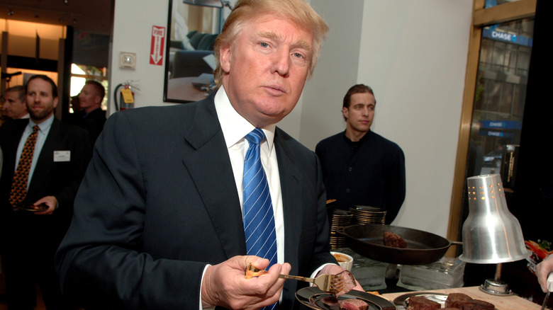 Donald Trump eating steak off a plate