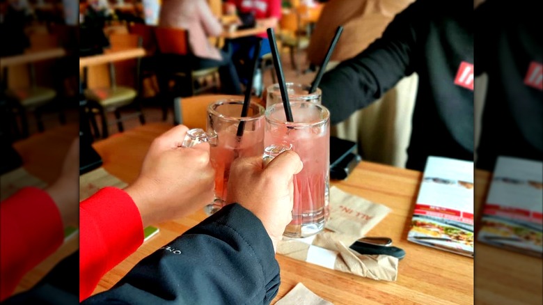 Friends cheersing Dollaritas at Applebee's