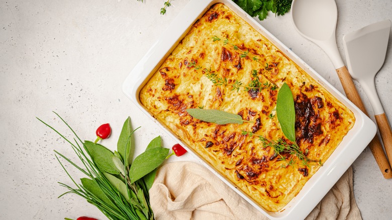 Mashed potato casserole topped with thyme and other herbs