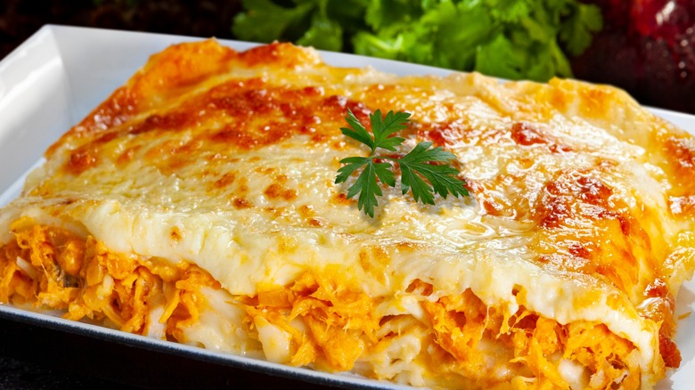 Chicken lasagna on white plate 