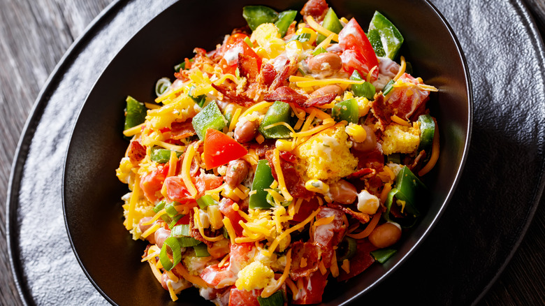 Cornbread salad in a black dish