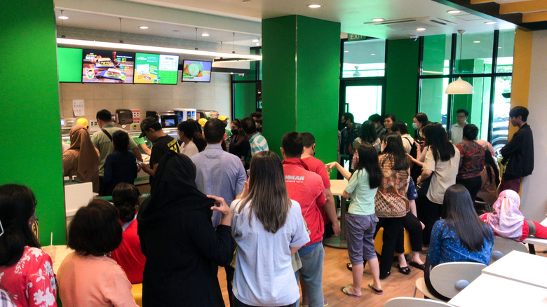 Subway restaurant crowded with customers