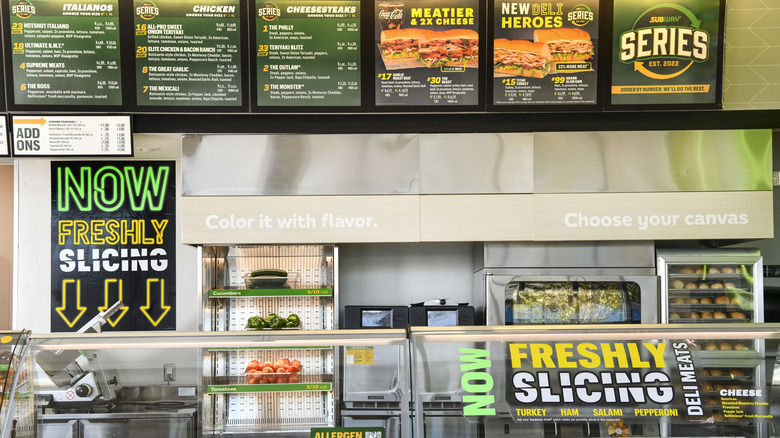 Subway counter, signs, and ingredients