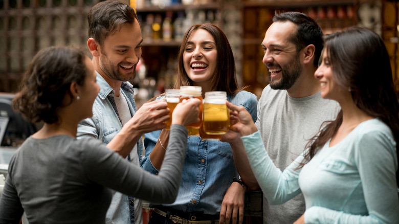 Group of friends sitting and drinking beer together