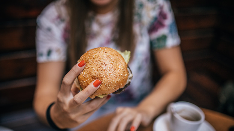 woman eating burger