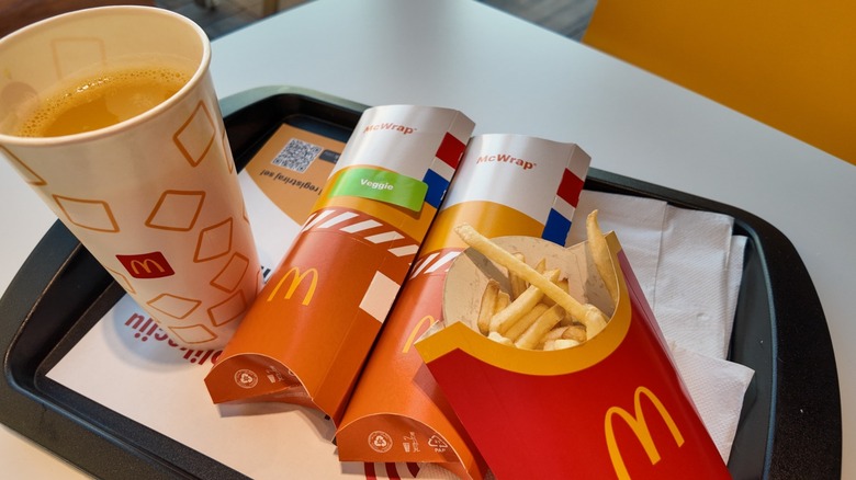 Two McWraps with fries and a coffee.