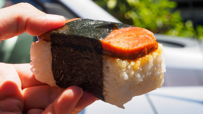 Someone holding a Spam musubi.