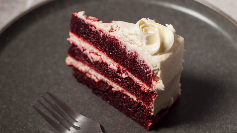 a slice of red velvet cake on a plate