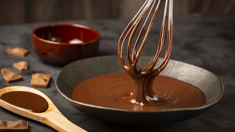 Chocolate ganache being whisked.