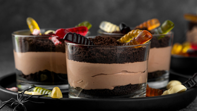 Chocolate mousse with cake and gummy worms