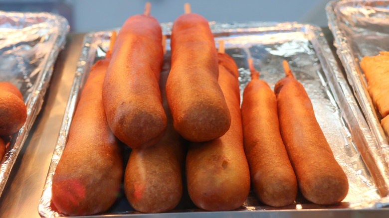 Seven stacked corn dogs in a display case