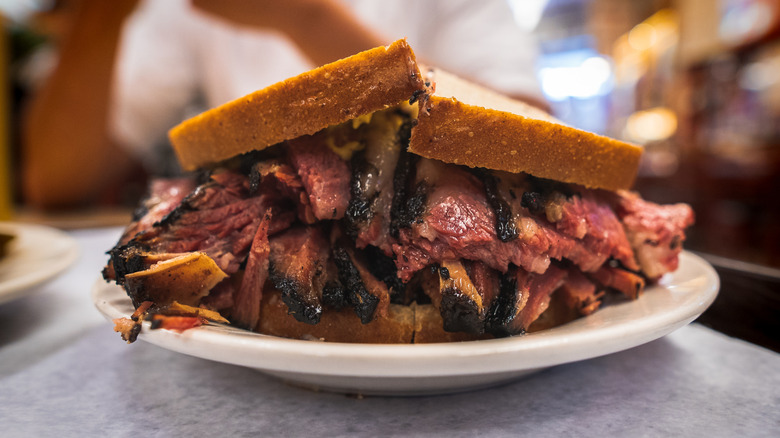 Close up shot of New York pastrami on a sandwich