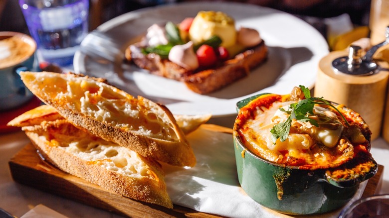 A meal at a French bistro, including crusty French bread.