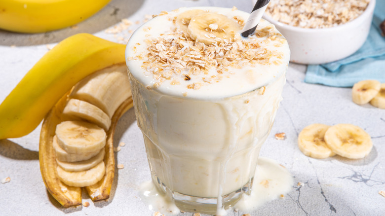 Banana oat smoothie with straw