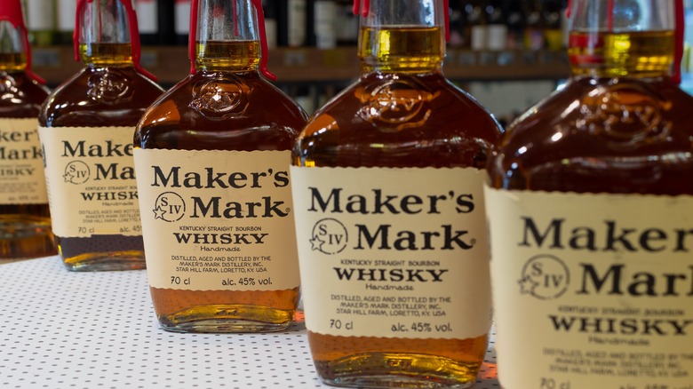 Bottles of Marker's Mark Bourbon arranged on a table.