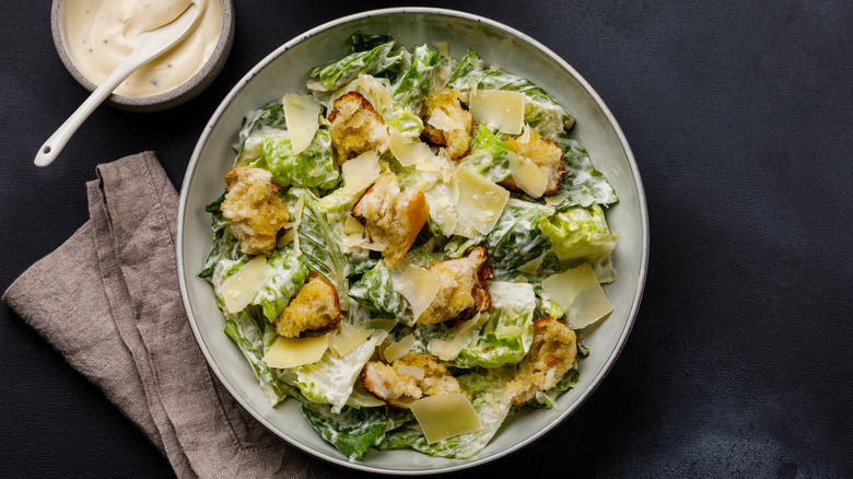 A Caesar salad and napkin