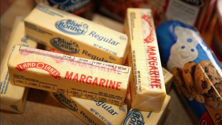 Margarine and butter sticks next to Pillsbury cookie dough