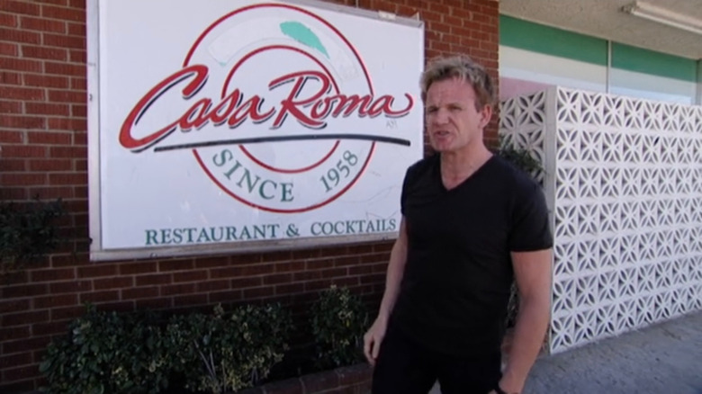 Chef Gordon Ramsay stands outside Casa Roma restaurant