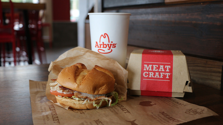 A burger, drink, and box of sides from Arby's