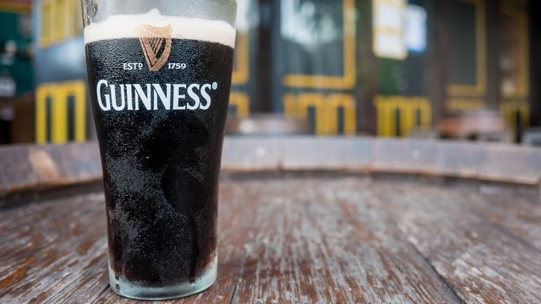 cold guinness glass on table