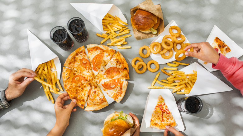 Several traditional fast food items sitting on a table.