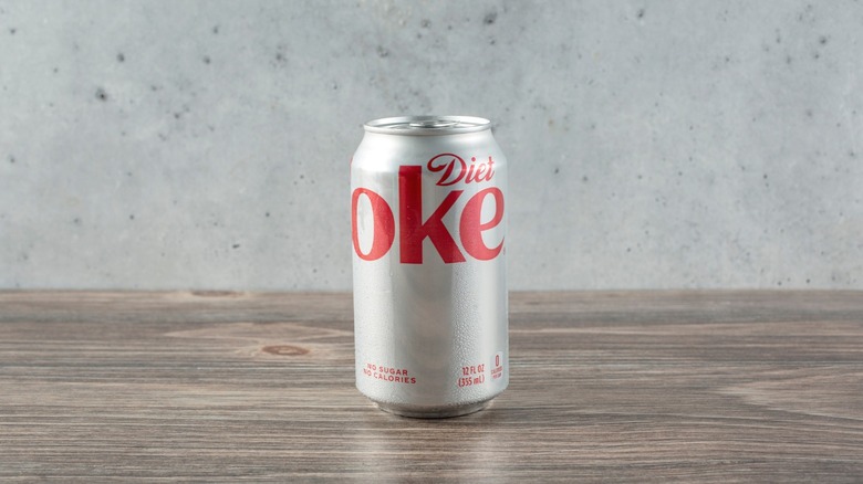 A can of Diet Coke sitting on a table.