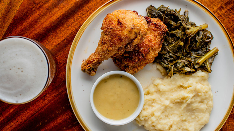 Homemade fried chicken dinner with beer