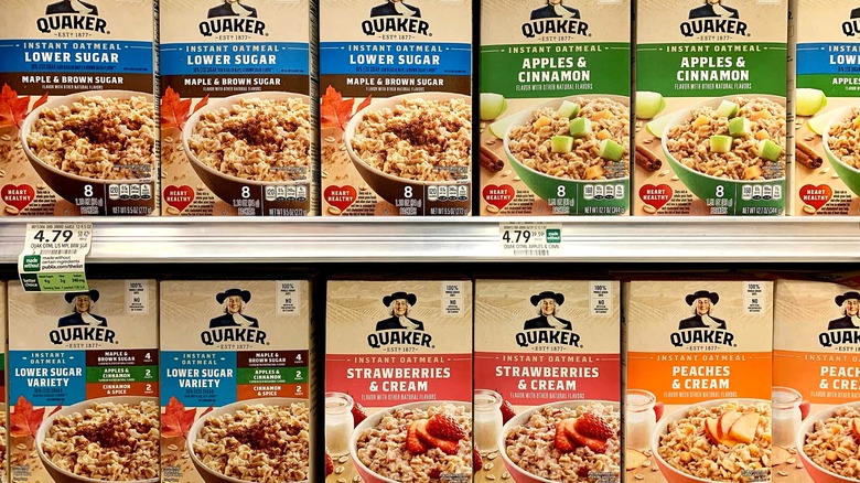 Boxes of Quaker Oats instant oatmeal on a supermarket shelf