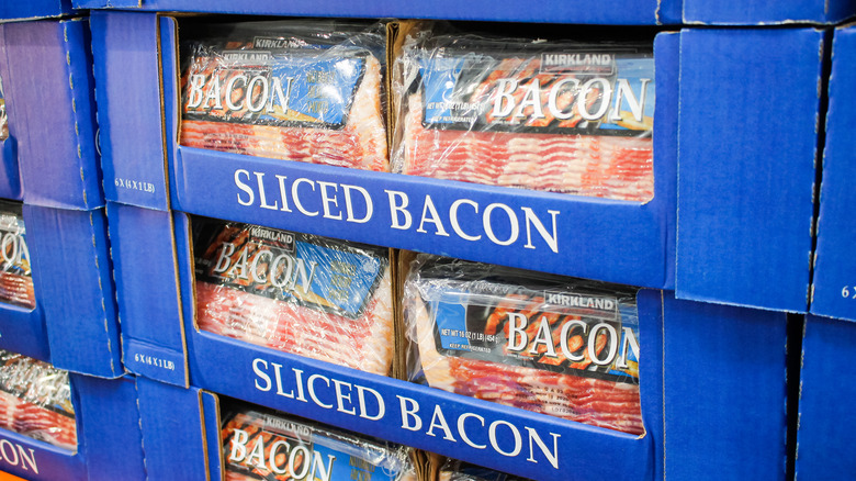 Packs of Kirkland brand bacon sit in cases