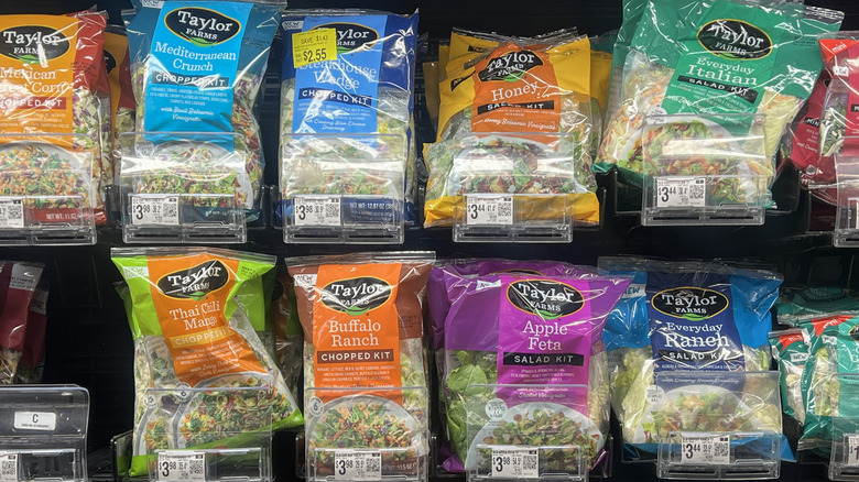 A shelf of Taylor Farms salads at the grocery store