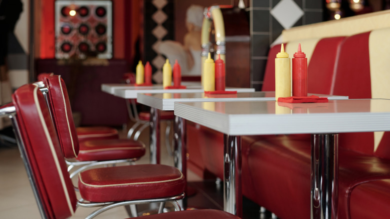 An empty diner booth and chairs