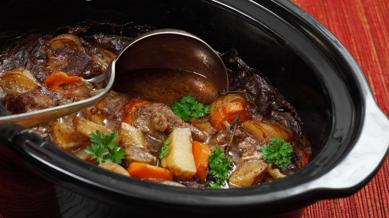 slow cooker stew made with meat, potatoes, and carrots