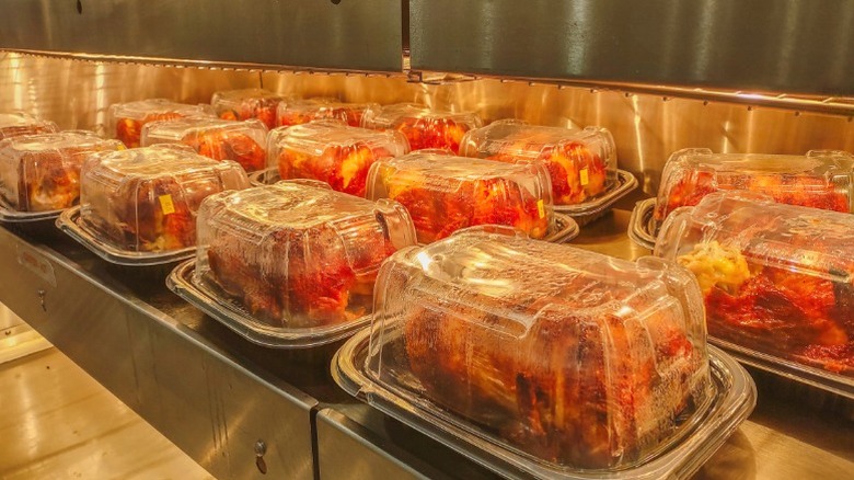 Costco rotisserie chickens in their signature clamshell packaging.