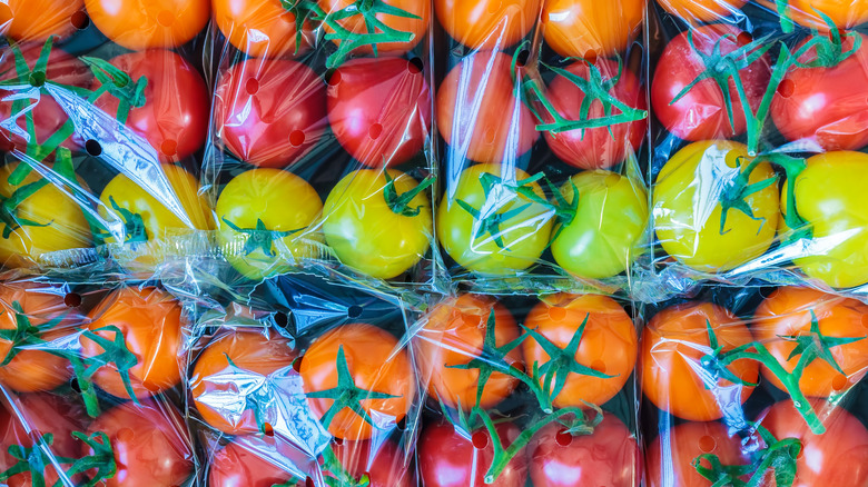 Tomatoes wrapped in plastic bags