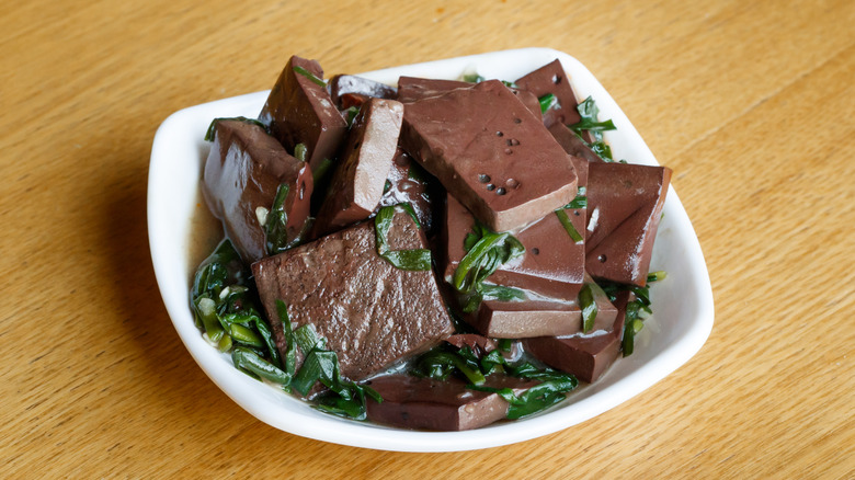 Chinese duck blood tofu served in a dish.