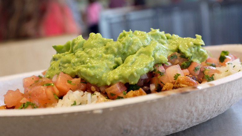 Chipotle bowl with pile of guacamole