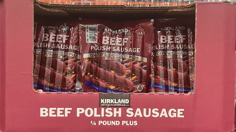 A box full of packaged Kirkland Signature polish sausages