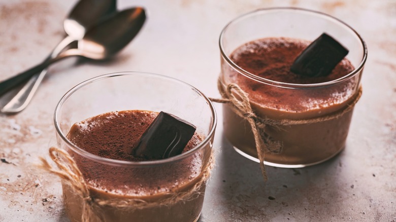 Two glasses of chocolate pudding.