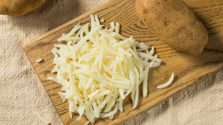 Shredded potatoes on a cutting board