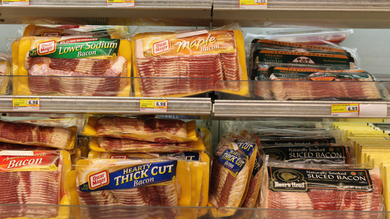 Grocery store display of bacon packages