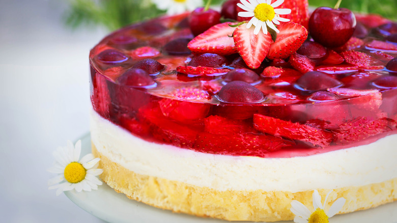 Strawberry Jell-O cheesecake with a flower on top