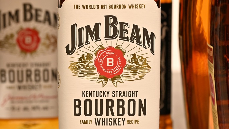 A close-up of a bottle of Jim Beam Kentucky Straight Bourbon Whiskey.