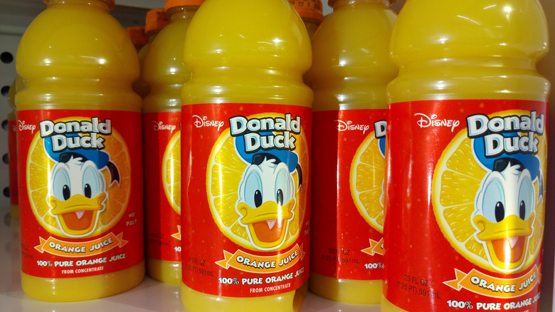 20 ounce bottles of Donald Duck Orange Juice on a store shelf