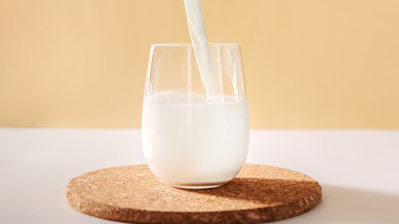 pouring milk into glass