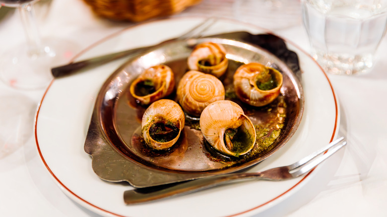 A plate of cooked escargot