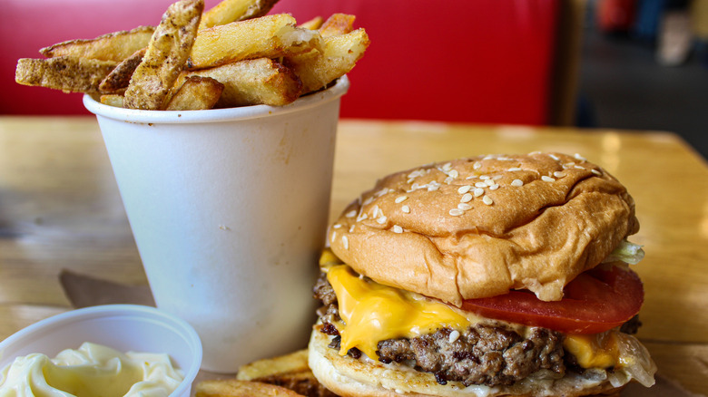 Five Guys fries and cheeseburger in booth