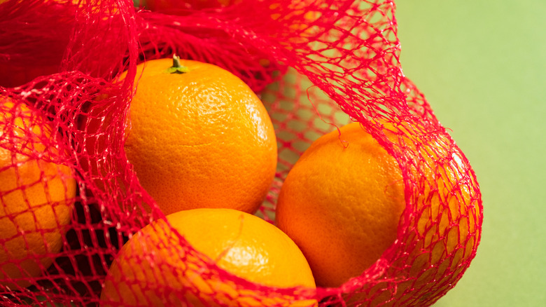 oranges in a mesh bag